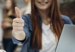 smiley-redhead-business-woman-giving-thumbs-up smiley-redhead-business-woman-giving-thumbs-up
